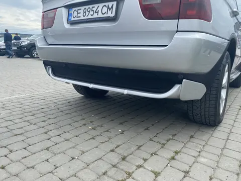 Накладка на задній бампер (під фарбування) для BMW X5 E53 1999-2006 рр — BMW X5 E53 1999–2006 гг. DianaParts