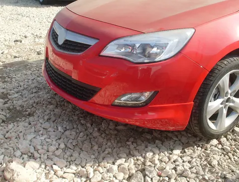 Передня нижня накладка 2010-2012 (під фарбування) для Opel Astra J рр — Opel Astra J 2009-2015 гг. DianaParts